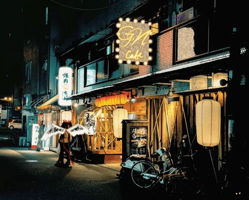 An angel and a demon stand outside of a restaurant in Japan at night to smoke and talk about life and death.