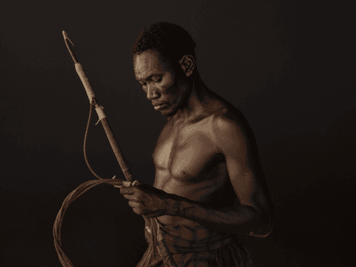 Ethiopia - Portraits - Portrait of Luchala with harpoon used for subsistence crocodile hunting